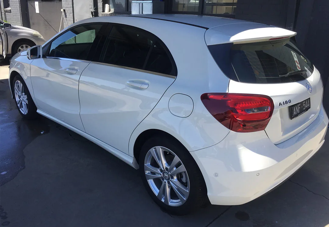 The same white Mercedes A-Class after restoration, paint clean