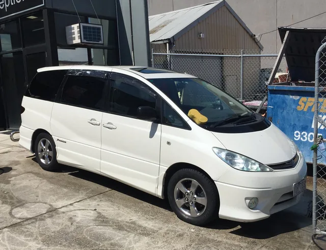 The same Toyota van restored, paint clean and undamaged