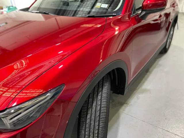 Red Mazda SUV finished in the workshop