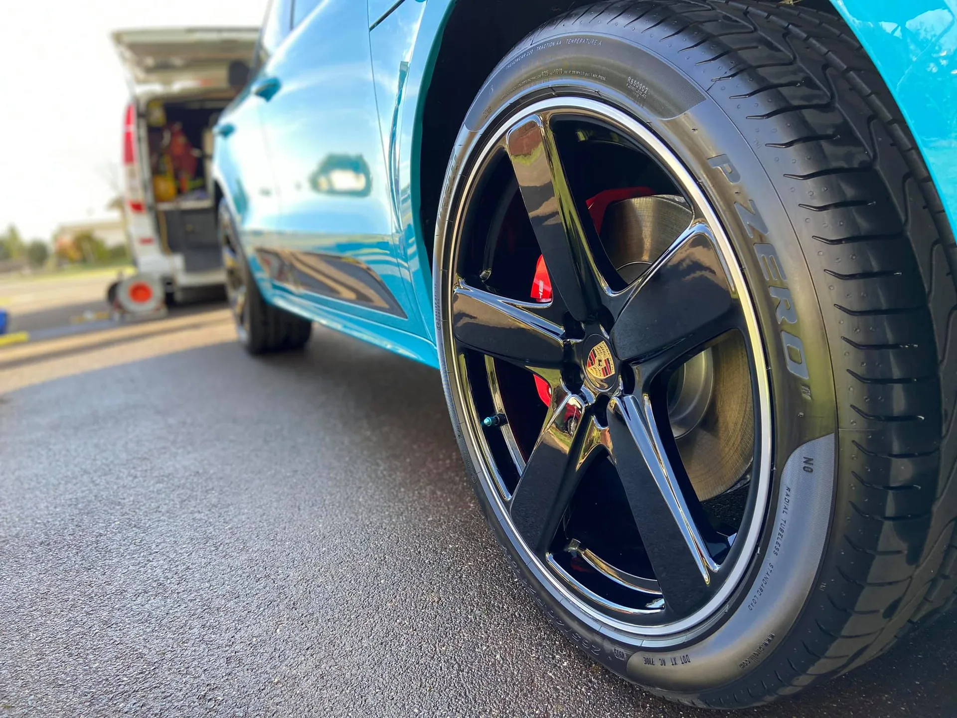 Porsche wheel and arch cleaned of contamination