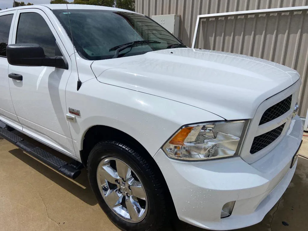 Restored white RAM pickup after overspray removal