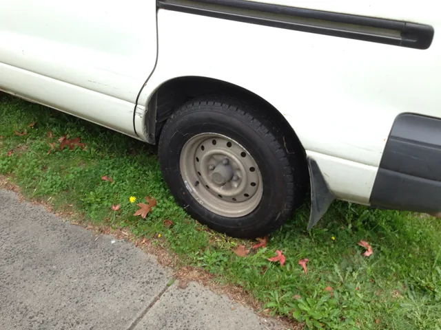 Older white ute with contamination down the flank